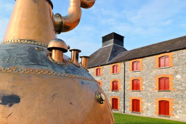 Whiskey distillery in Ireland with old copper kettle